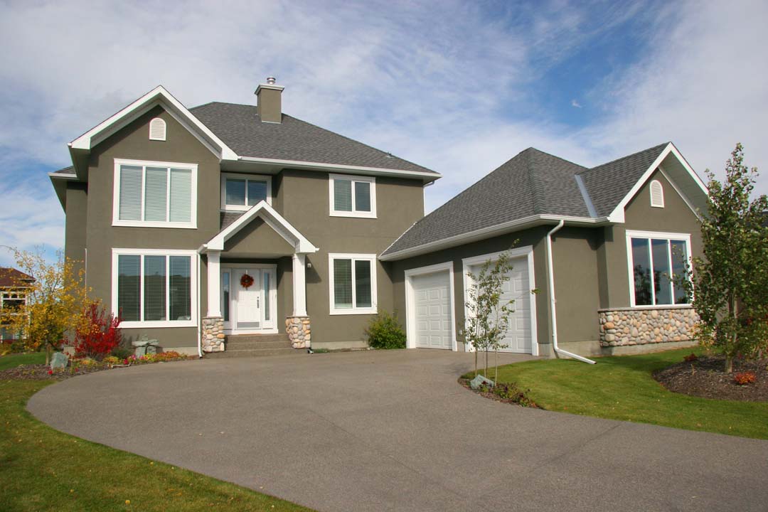 Two-story estate house with long driveway